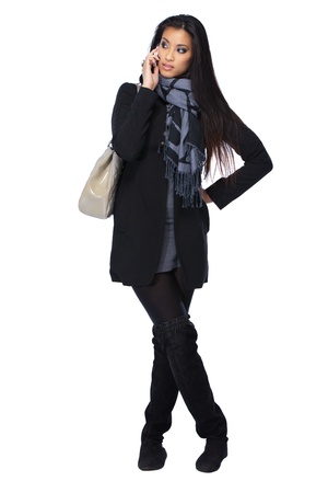 young asian woman with cellphone isolated on whiteの写真素材