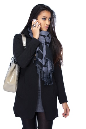 young asian woman with cellphone isolated on whiteの写真素材