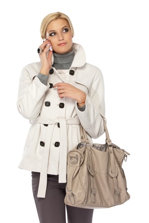 blonde caucasian woman with cellphone isolated on whiteの写真素材