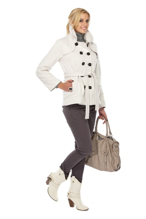 sexy blonde woman in fashion clothes isolated on whiteの写真素材