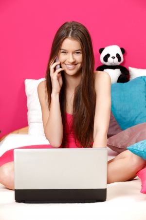 nice young woman planning her night with her friendsの写真素材