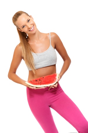 blonde woman posing with fruit isolated on whiteの写真素材