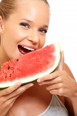 nice blonde woman with melon isolated on whiteの写真素材