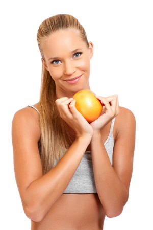 beautiful blonde woman posing with a fruitの写真素材
