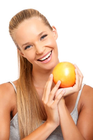beautiful blonde woman posing with a fruitの写真素材