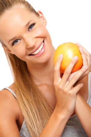 nice lady posing with orangeの写真素材