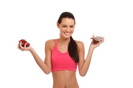 happy young woman posing with strawberry and chocolateの写真素材