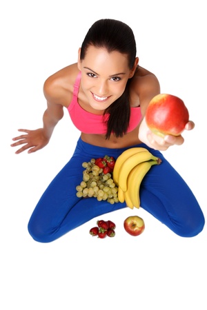 nice brunette lady posing with healthy foods on white backgroundの写真素材