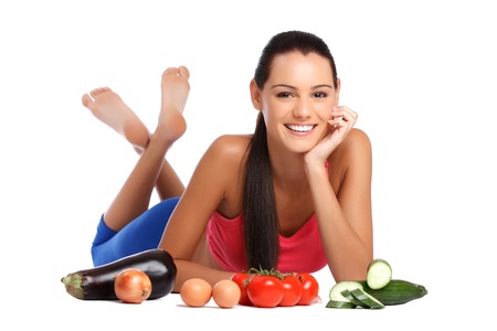 beautiful healthy young woman with vegetables isolated on whiteの写真素材