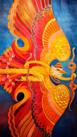 Beautiful dragon head in red and orange colors on a blue backgroundの写真素材