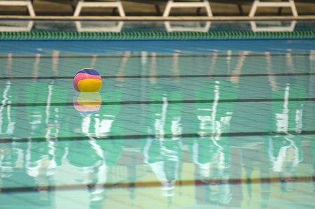 Water polo action and equipment in a swimming pool