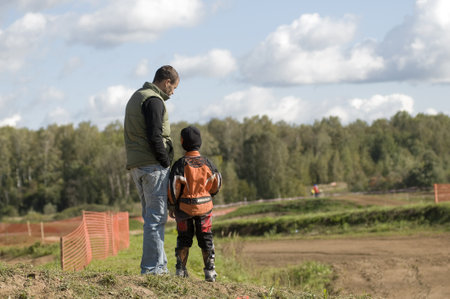 MOSCOW-SEPTEMBER 8: Sukhotin Seraphim (Vidnoe) with the coach to discuss the race track in the Stage III Cup XSR-MOTO.RU Cross Country in Moscow, Sheremetyevo, motostadion のeditorial素材