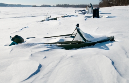 Hibernating under the snow with a motor boatの写真素材