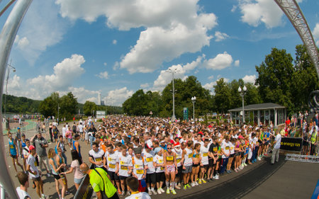 RUSSIA, MOSCOW-JULY 13: Several unidentified runners starting at start line of mass race Adidas energy run at the sports festival "Moscow City Games 2013" in Moscow, Arena "Luzhnik" on July 13, 2013のeditorial素材