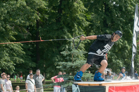RUSSIA, MOSCOW-JULY 13: An unidentified rider performs intricate tricks for wakeboarding in the sports festival "Moscow City Games 2013" in Moscow, Arena "Luzhniki»; on July 13, 2013のeditorial素材