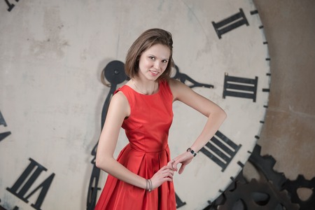 Beautiful young girl in a red dress