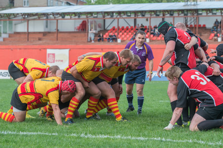 MOSCOW - MAY 13: Some players in action at rugby Russian Rugby Championship 2014 match between Slava CSP (yellow) and Metallurg (black), final score 20-13, on May 13, 2014, in Moscow stadium Slava Russia.のeditorial素材