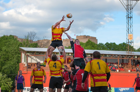 MOSCOW - MAY 13: Some players in action at rugby Russian Rugby Championship 2014 match between Slava CSP (yellow) and Metallurg (black), final score 20-13, on May 13, 2014, in Moscow stadium Slava Russia.のeditorial素材