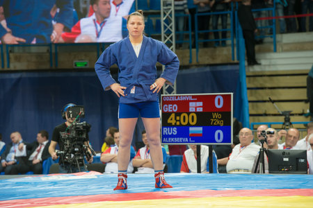 RUSSIA, MOSCOW - MARCH 27: Alekseeva Irina (blue) vs Odzelashvili Nino on World Cup Memorial A. Kharlampiev in Stadium Druzhba sport palace Luzhniki, Moscow, Russia, 2015のeditorial素材