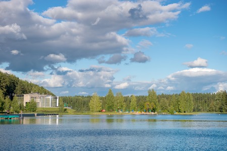 Summer vacation on the shore of forest lakeの写真素材