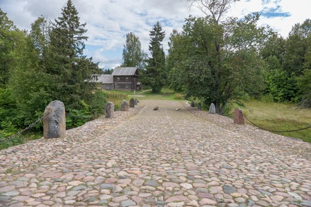 Hundred-meter boulder-arch bridge with two grotto - aviary, called by locals "Devil's Bridge." Consisting of dry stacked boulders, kept only by gravityの写真素材
