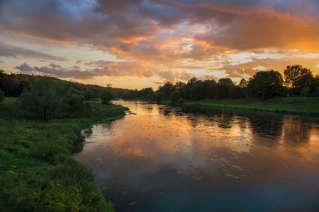 Beautiful summer sunset in the riverの写真素材