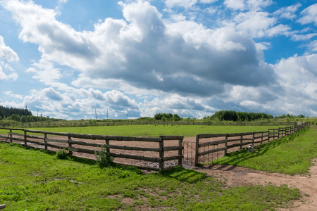 Wooden slit rail fence in the pasture for horsesの写真素材