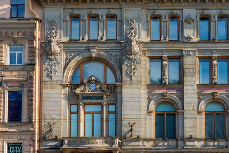 RUSSIA, SAINT PETERSBURG - AUGUST 18, 2017: Fragment of an old building facade with ornate decoration in the center of St. Petersburg at sunny day, Russia.のeditorial素材