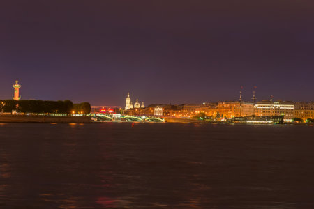 RUSSIA, SAINT PETERSBURG - AUGUST 18, 2017: View from the Neva River to the Strelka of the Vasilievsky Island, the Exchange Bridge and the Prince Vladimirsky Cathedral in a dark summer nightのeditorial素材
