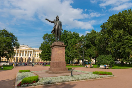 RUSSIA, SAINT PETERSBURG - AUGUST 18, 2017: Monument to the great russian poet Alexander Pushkin on Arts Square and The State Russian Museum of His Imperial Majesty Alexander III on backgroundのeditorial素材
