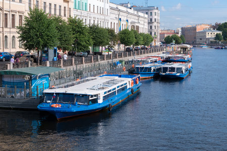 RUSSIA, SAINT PETERSBURG - AUGUST 18, 2017: A promenade excursion boat ????? at the embankment of the Fontanka River near Anichkov Bridgeのeditorial素材