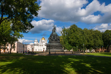 VELIKY NOVGOROD, RUSSIA - AUGUST 14, 2018: Monument Millenium of Russia on the background of St. Sophia Cathedral with tourists walking along in summer dayのeditorial素材