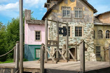 Moscow region, Film City Piligrim Porto, August 5, 2020: Empty scaffold with a place for execution and wooden gallows. Architecture houses of the European middle ages, Wooden scenery of the old city for filming feature filmsのeditorial素材