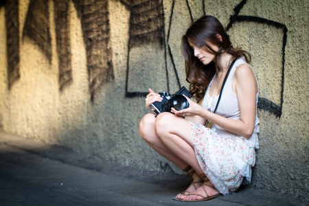 Girl posing with Cameraの写真素材