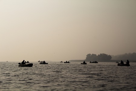 Fishermen on a boat in the fog stock imageの写真素材
