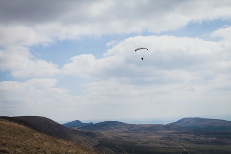 the wind blows away the paraglider