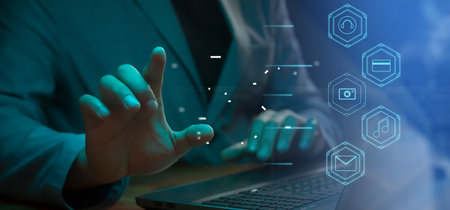CG tech collage. Against the background of a silhouette of an employee with a laptop with icons with...