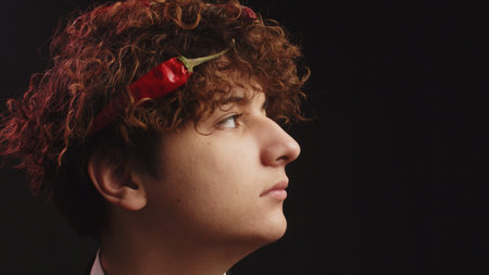 A red hot pepper in his hair.