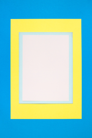 Composition with white, blue and yellow sheetsの写真素材