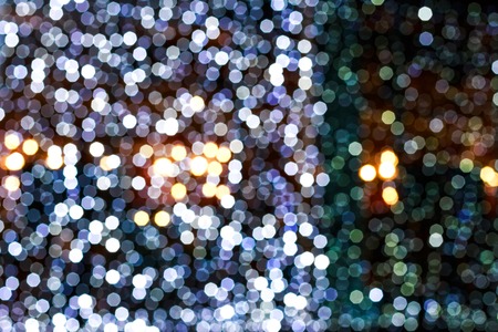 Blurry facade with bokeh garlands. Festive New Year lightsの写真素材