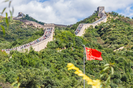 Chinese flag on the background of the Great Wallの写真素材