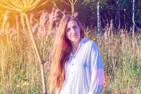Portrait of a dreamy fairy girl outdoor.の写真素材