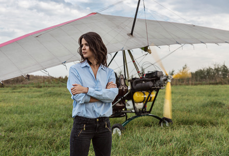 Girl brunette and a hang glider.