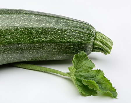 Green zucchini with leaves in studio.の写真素材