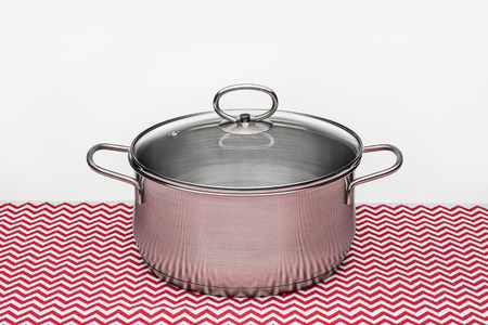 Metal pot with lid closed for cooking. Studio shot, copy space.の写真素材