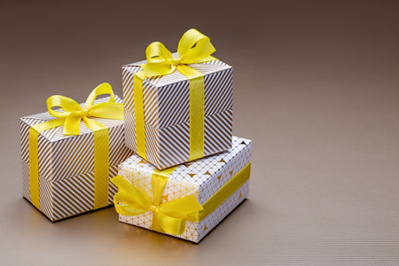 Gifts in shiny packaging for various holidays and events. Close-up, studio shot.
