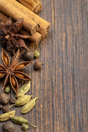 Close-up top view of various spices. A set of spices, cooking seasonings, anise, cardamom, cinnamon,...