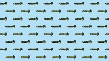 Metal screws on a blue background, fixing material. Pattern, template, background, studio shot.