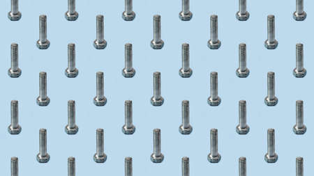 Metal bolt on a blue background, fixing material. Pattern, template, background, studio shot.