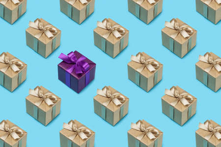 Gift boxes in festive packaging on blue. Background pattern, close-up.の写真素材